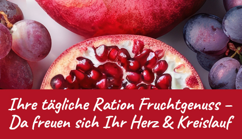 Fruchtgenuss für Herz & Kreislauf – Natürlich gesund! Aufgeschnittener Granatapfel und rote Trauben in Nahaufnahme.