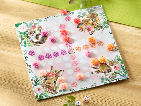 Spielbrett mit Hasenmotiv und rosa Spielfiguren