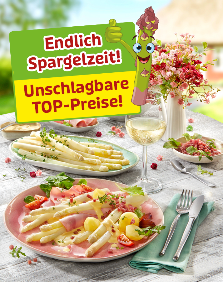 Spargelgericht mit Schinken, Sauce und Weißwein auf gedecktem Tisch