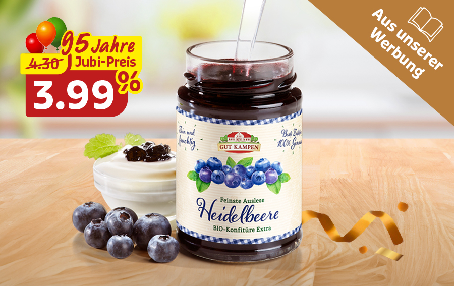 Heidelbeer-Konfitüre im Glas mit frischen Beeren