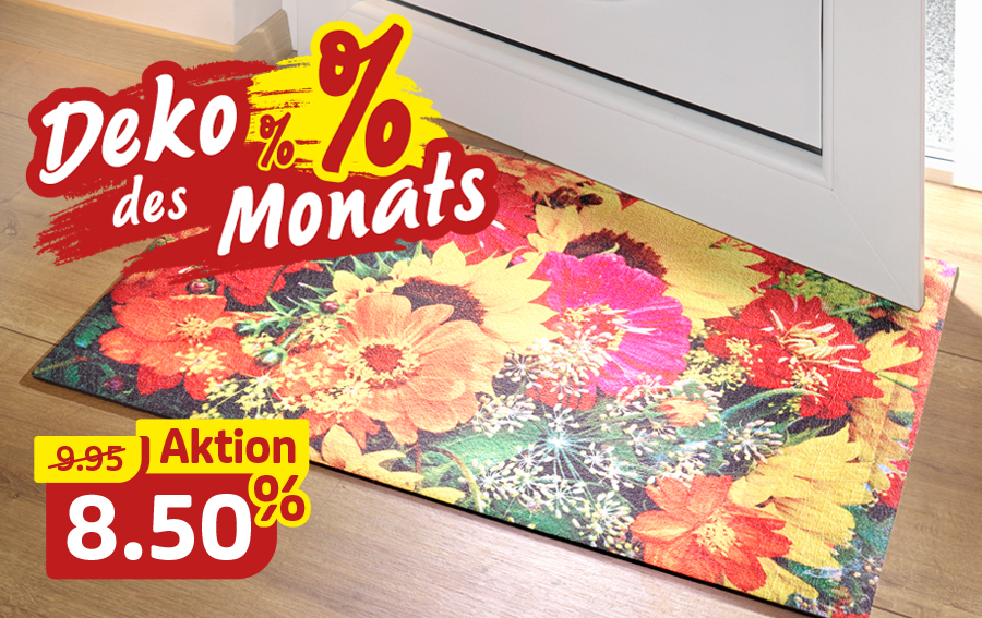 Bunte Fußmatte mit Blumenmotiv vor einer Tür