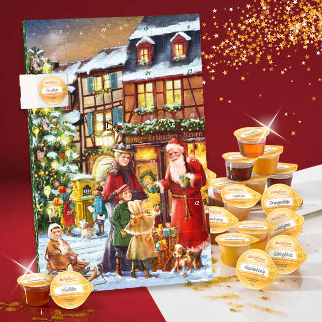 Adventskalender mit Honigportionen vor rotem Hintergrund
